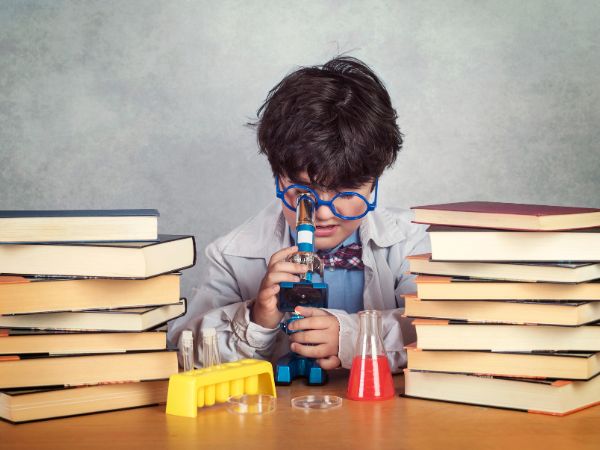 child with a microscope
